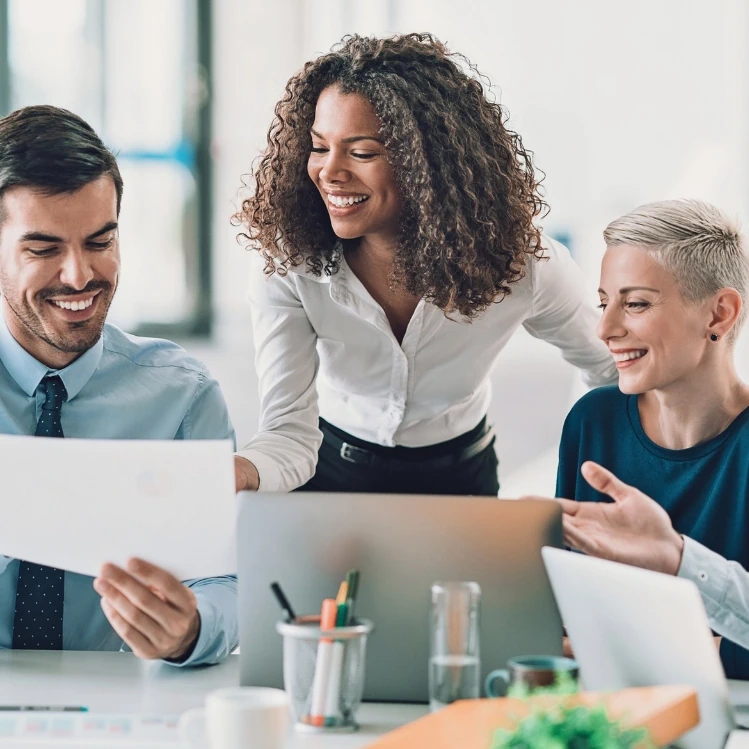 Female manager assisting colleagues during a meeting