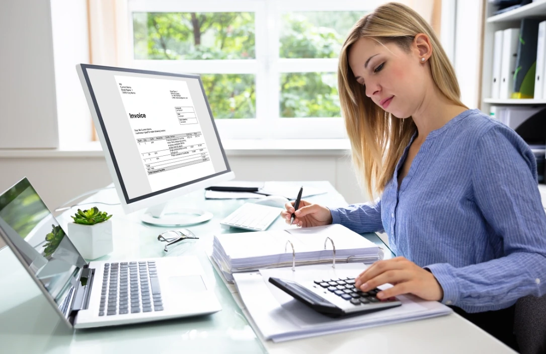 Female accountant analysing data at a computer